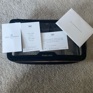 Anya Hindmarch in-flight case black and clear